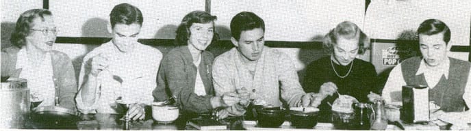 Group of people eating ice cream at counter