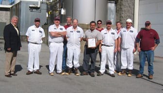 Stewart's Employees Outside with award