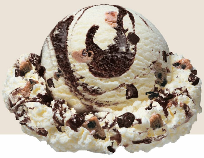 Scoop of Brownie Cookie Sundae. This is a vanilla flavor featuring chewy brownie bites, soft cookie dough pieces, and a rich fudge swirl.