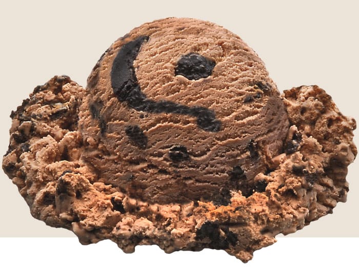 A scoop of Mousse Trail, a chocolate mousse ice cream is enhanced with a decadent cookie crumble chocolate swirl.