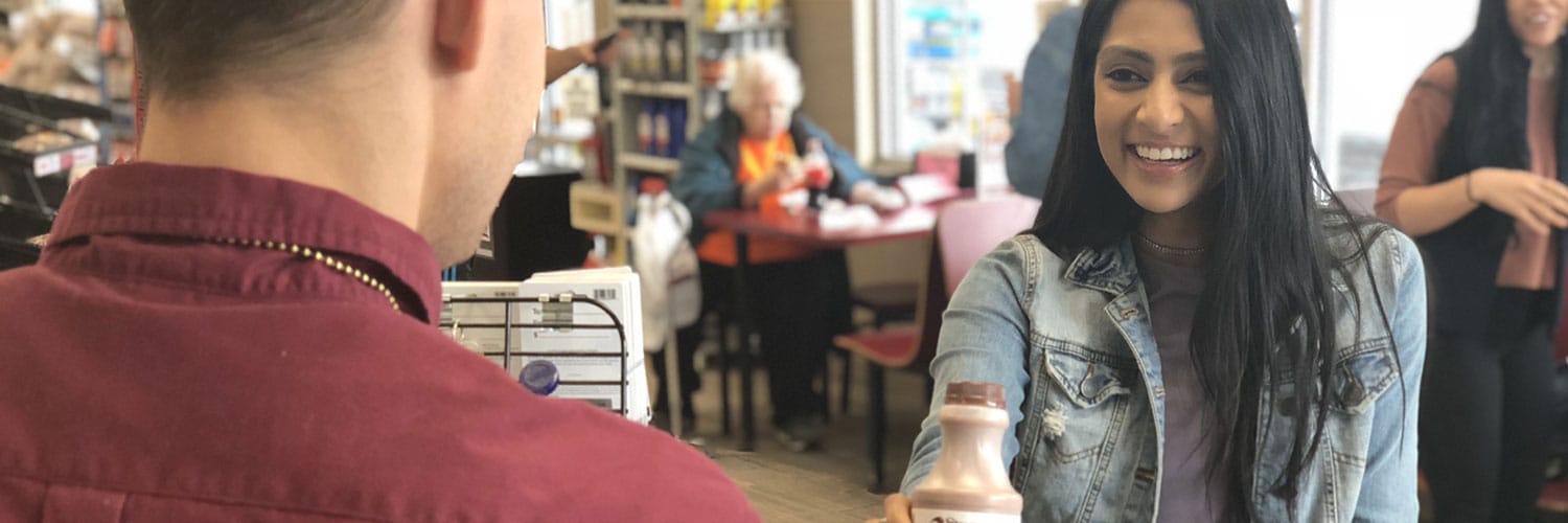 Woman checking out at Stewart's Counter