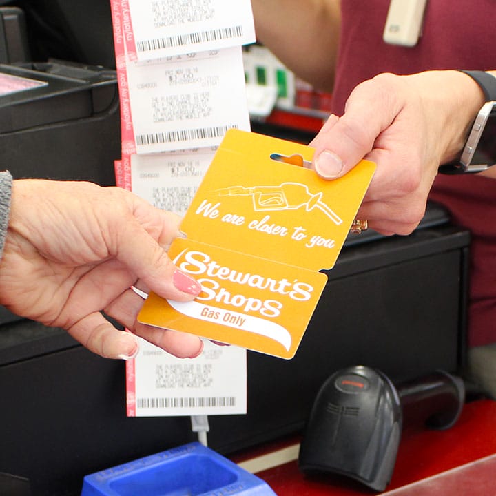 customer handing employee gas card