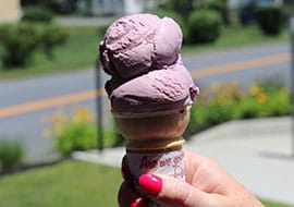 black raspberry ice cream on a cone