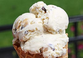 chocolate chip cookie dough ice cream in a waffle cone