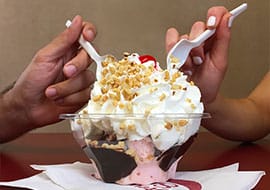 strawberry ice cream in a hot fudge sundae
