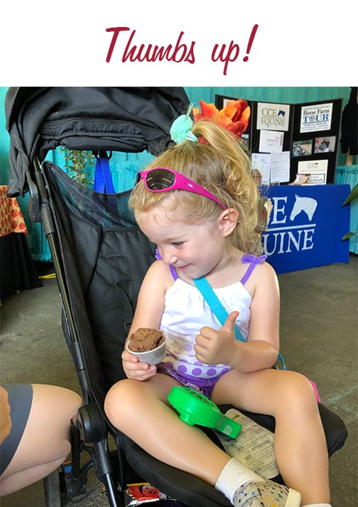 little girl thumbs up