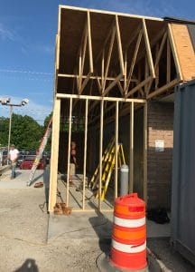 beams of an addition to a stewart's shop with roof