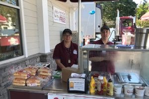 partners outside of shop cooking