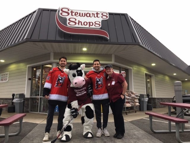 hockey players in front of stewarts with flavor mascot
