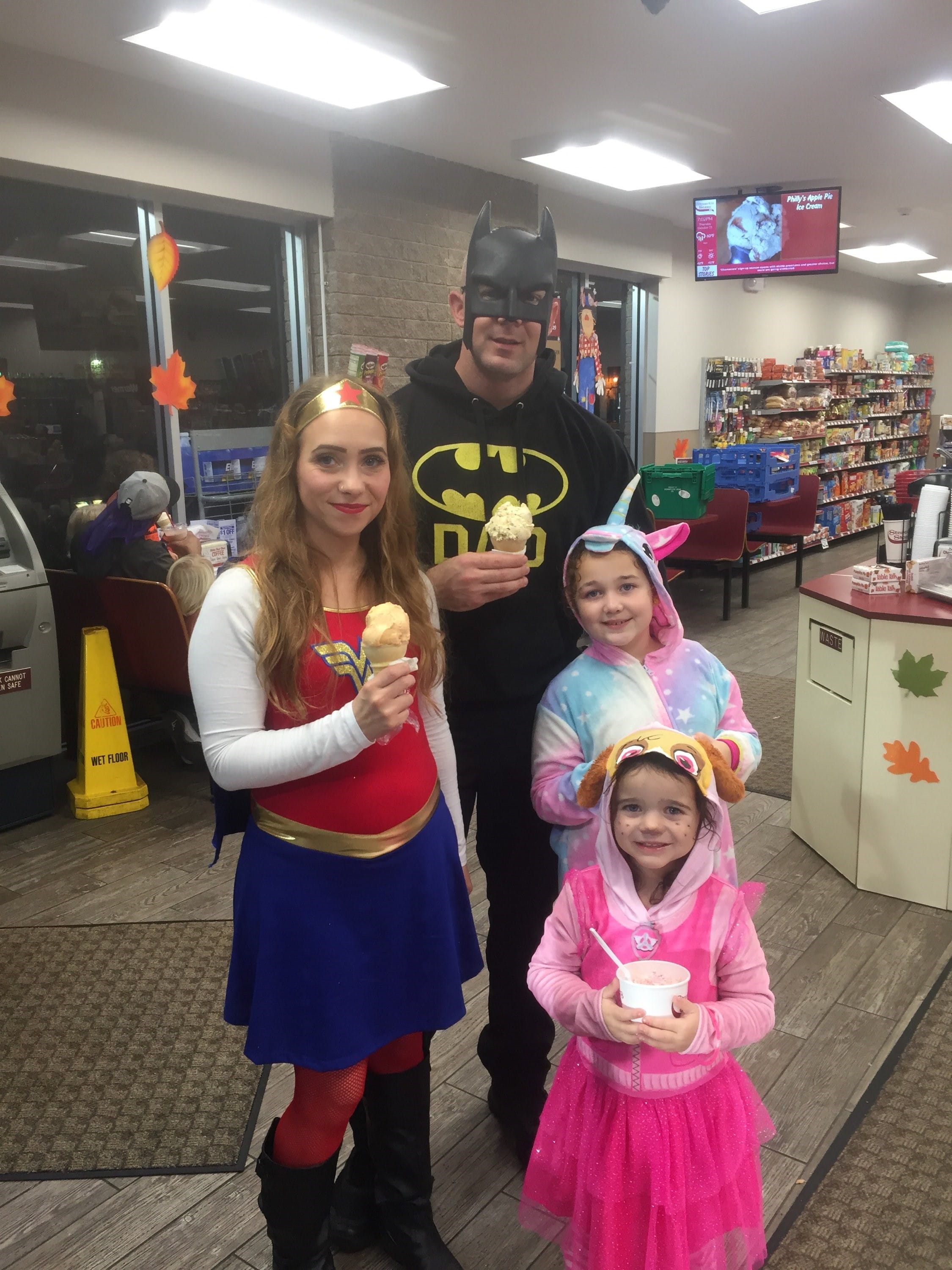 Family dressed up getting ice cream