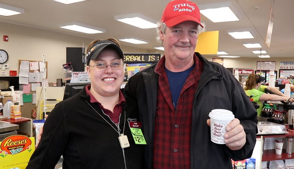 Lucky winner with shop manager