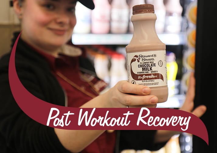 Post workout Recovery. Stewarts chocolate milk refresher held by a Strewarts partner