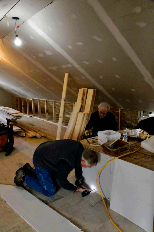 Interior house construction with workers