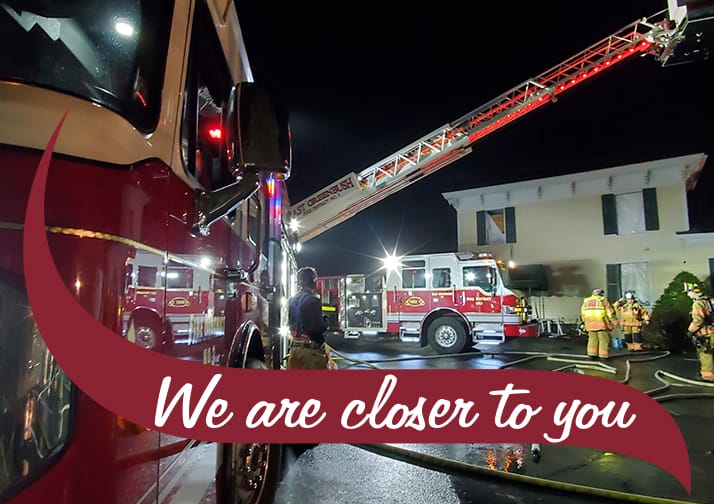 We are closer to you. Fire trucks outside a yellow house