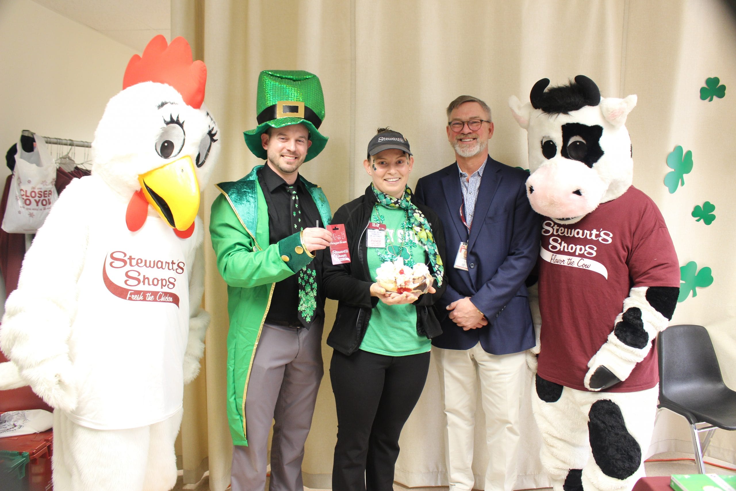 The chicken mascot, Fresh, the dip off winner and two senior staff members and the cow mascot, Flavor.