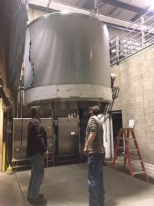 a tank being held up by chains