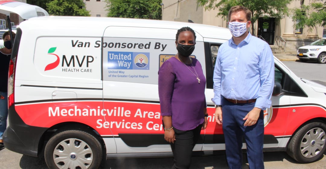 United Way CEO with meal delivery van