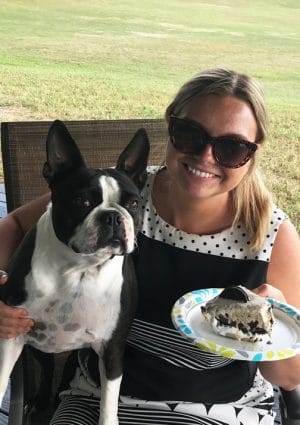 girl and dog with pie
