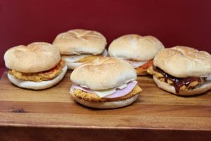 a group of chicken sandwiches in different flavors