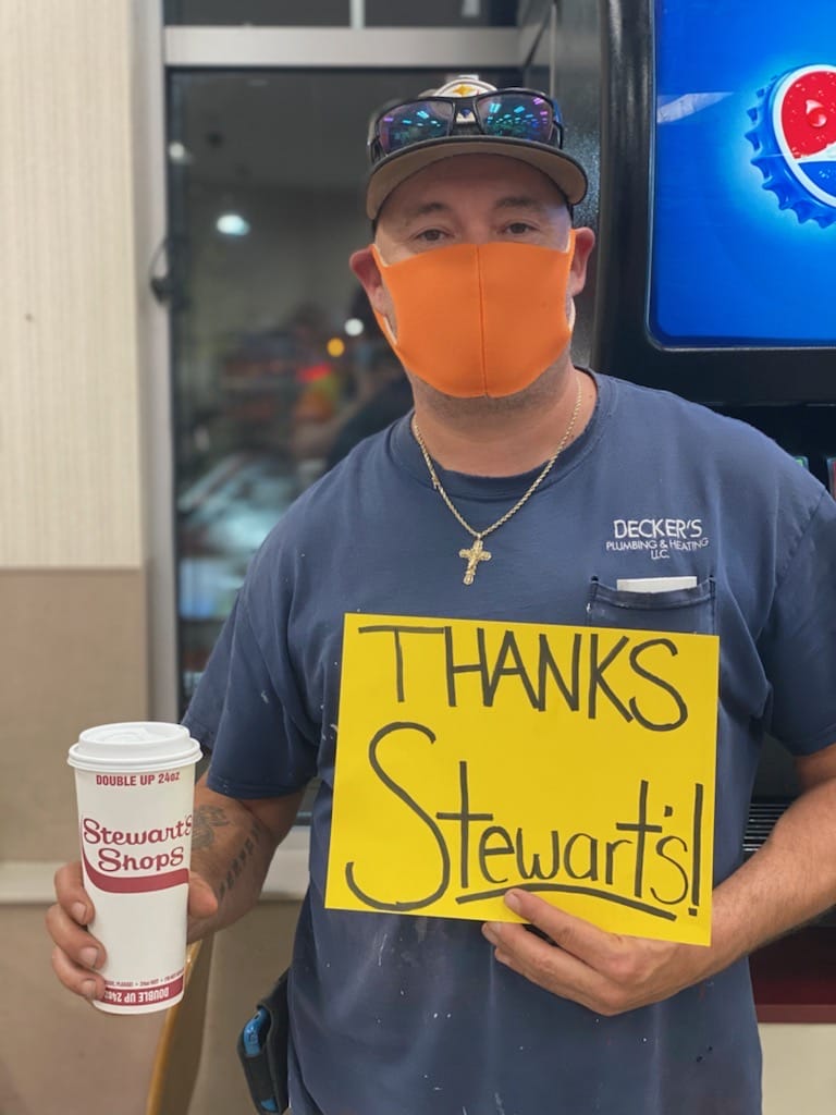 Customer holding Thanks Stewart's Sign