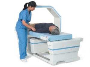 Nurse and Patient using bone density scanner.