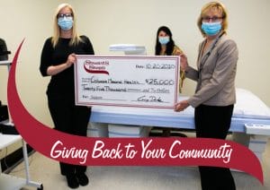 District Manager Andrea and CMH Chair presenting a check.