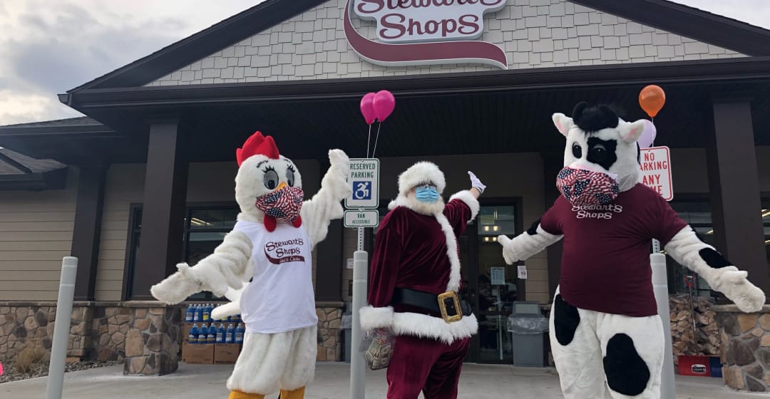 Chicken and Cow mascots with Santa