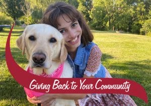 Nicole hugging her service dog Jacey