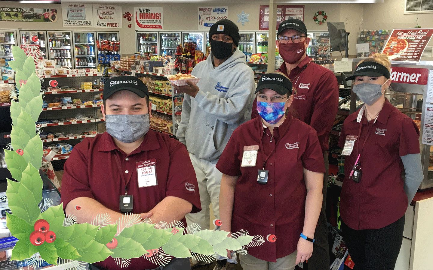 5 people in a stewarts shop. all wearing masks looking at the camera