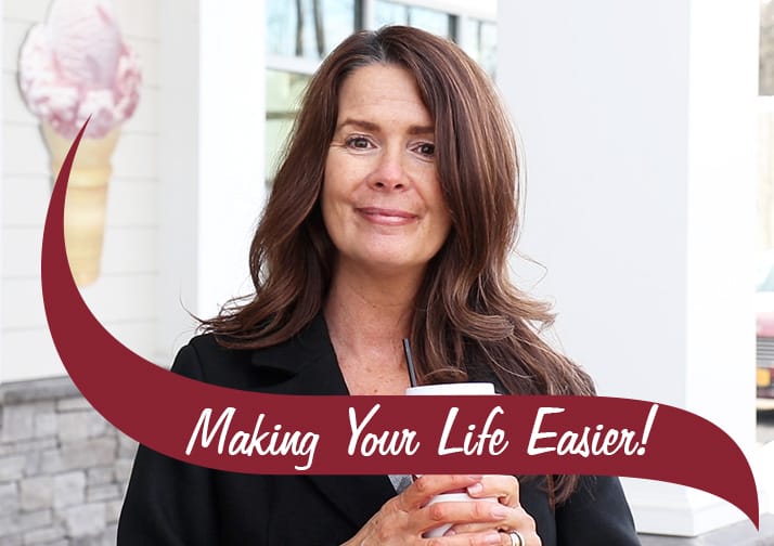 Making Your Life Easier. Mary in front of a shop holding a coffee