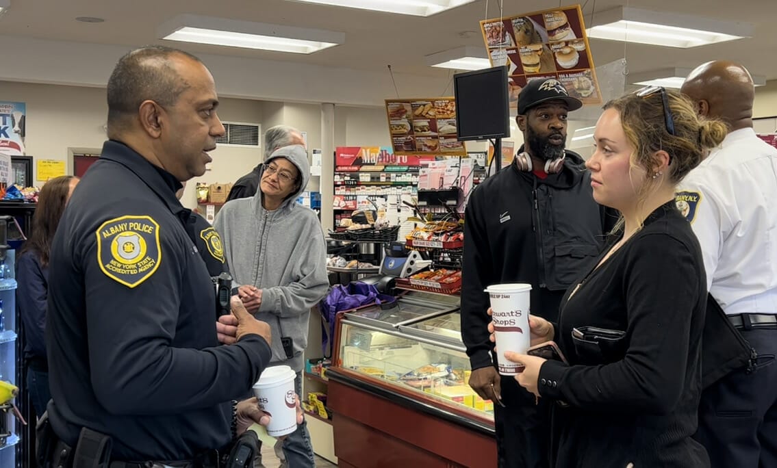 Cop Speaking with Civilians