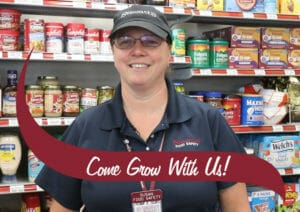 Stewarts Partner in front of grocery wall