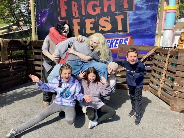 Kids posing with fright fest characters
