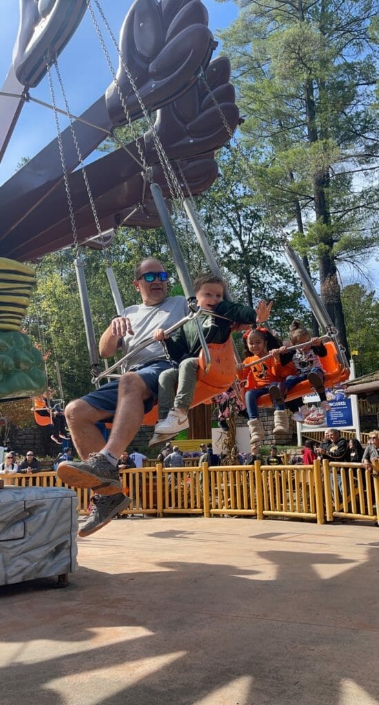 A Partner and child riding rides at great escape