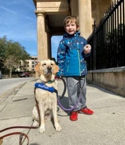 BluePath dog tethered to a kid for safety