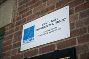 Gravity Renewables sign at Comtu Falls