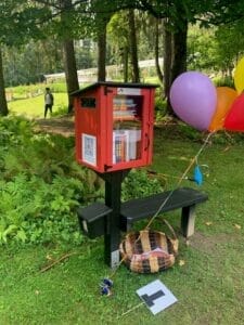 Yaddo Reads Lending Library books and bench 