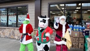 Flavor the cow in the middle, the Grinch on the left and Santa on the right. 