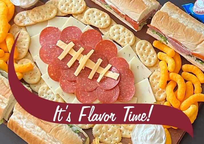 charcuterie board in the shape of a football.