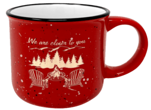 Red campfire mug with an Adirondack scene engraved.