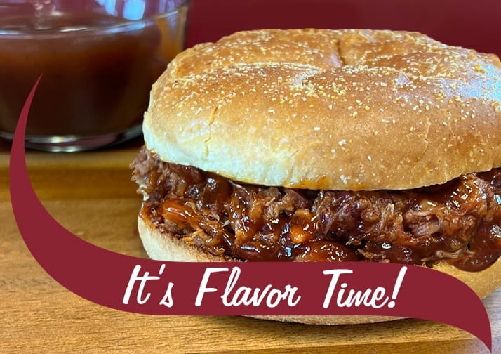 BBQ Pulled Pork Sandwich. Maroon wave in front that reads, "It's Flavor Time".