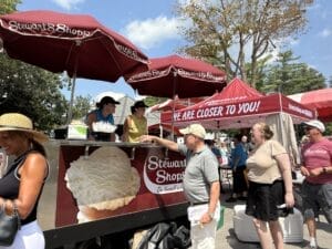 Partners handing out free ice cream on our ice cream cart to customers at Saratoga Race Track.