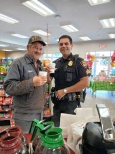 Customer and police officer having coffee